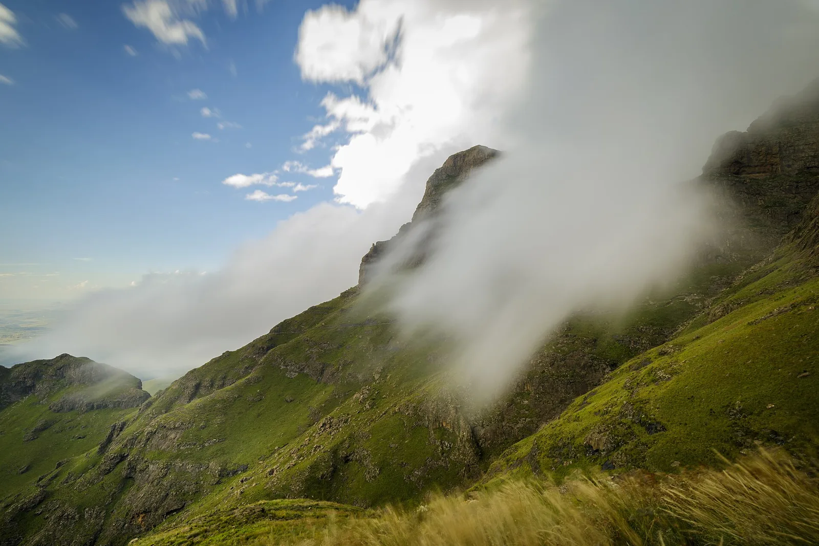Green Drakensberg foothills under cloud